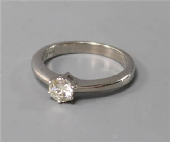 An 18ct white gold and solitaire diamond ring, size L.